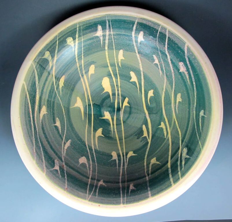 Porcelain bowl with manganese saturate glaze