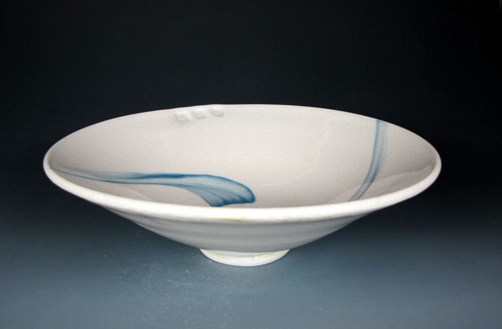 Porcelain bowl with shino and satin black glazes, sgrafitto pattern